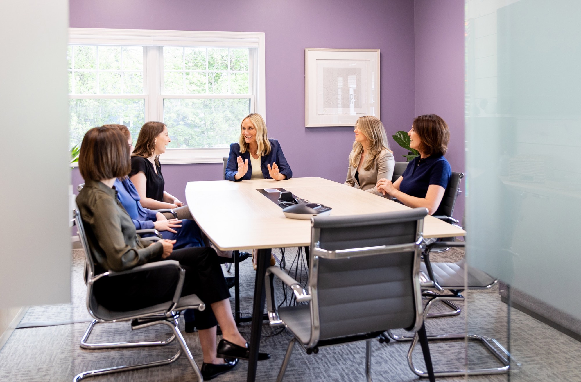 A meeting around the long conference table
