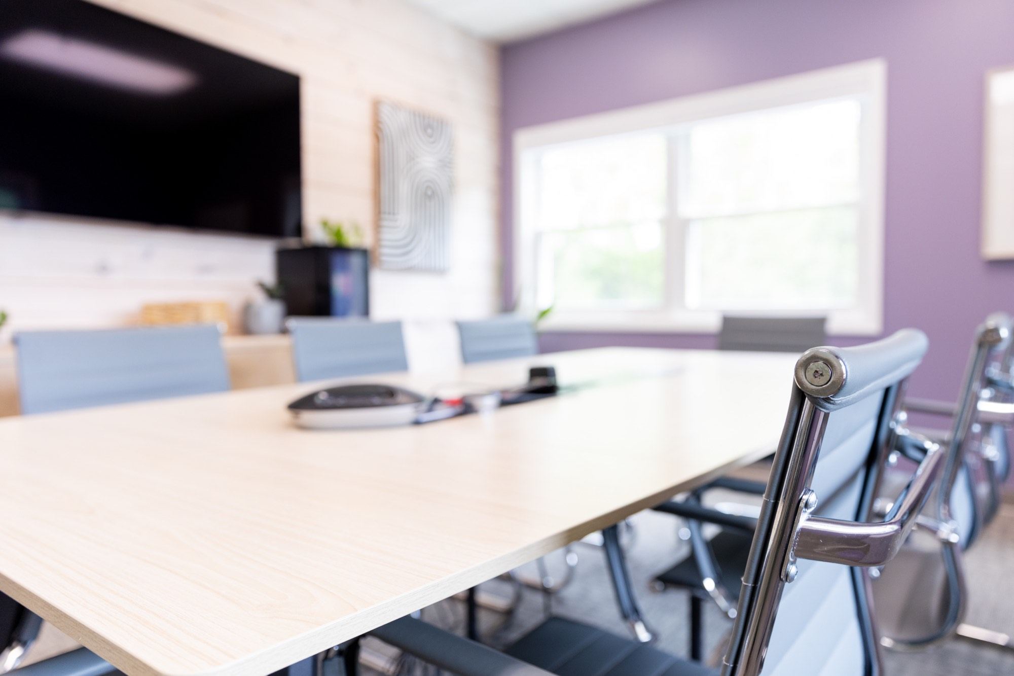 The Meliora Law boardroom, chairs drawn up to the table