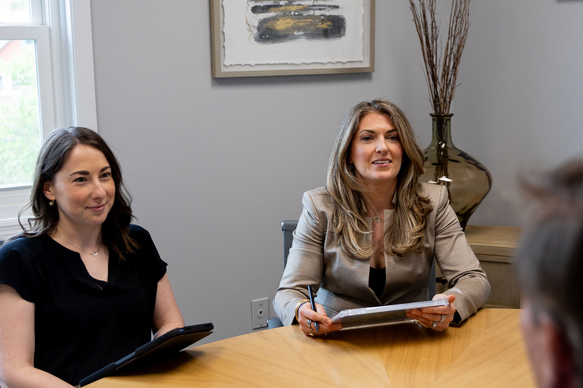 Three people meeting at a conference table